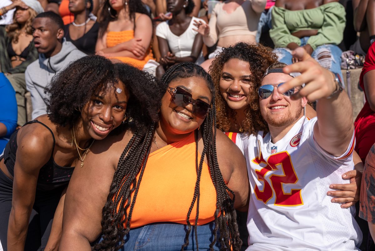 Four student pose for a photos at NPHC Yard Show